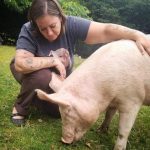 Carrie Shogan, Co-Founder of Little Oink Bank in Aldergrove, BC, Canada, with Mini (Minerva) the pig